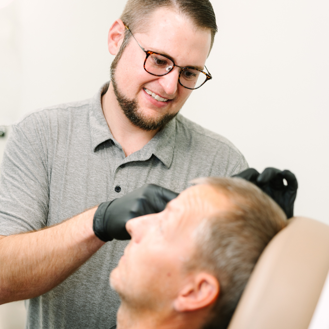 Provider examining patient's face