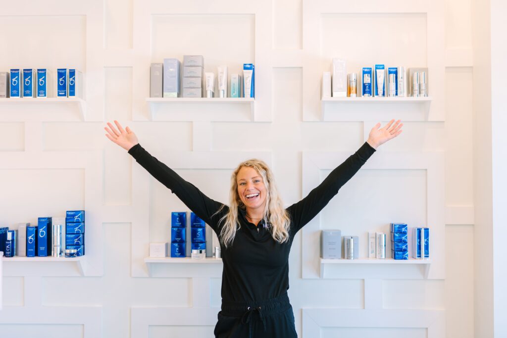 products at renew by or, girl in front of products with arms out